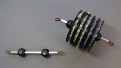 Fly fishing lanyard aluminum tippet post with cord lock snaps.